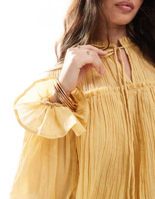 ASOS DESIGN tie neck ruffle detail crinkle long sleeve smock top in mustard