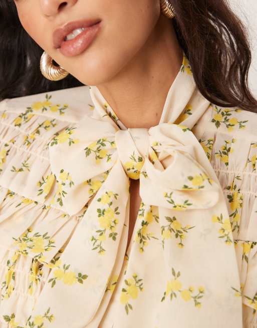 ASOS DESIGN tie neck shirred frill detail top in floral print