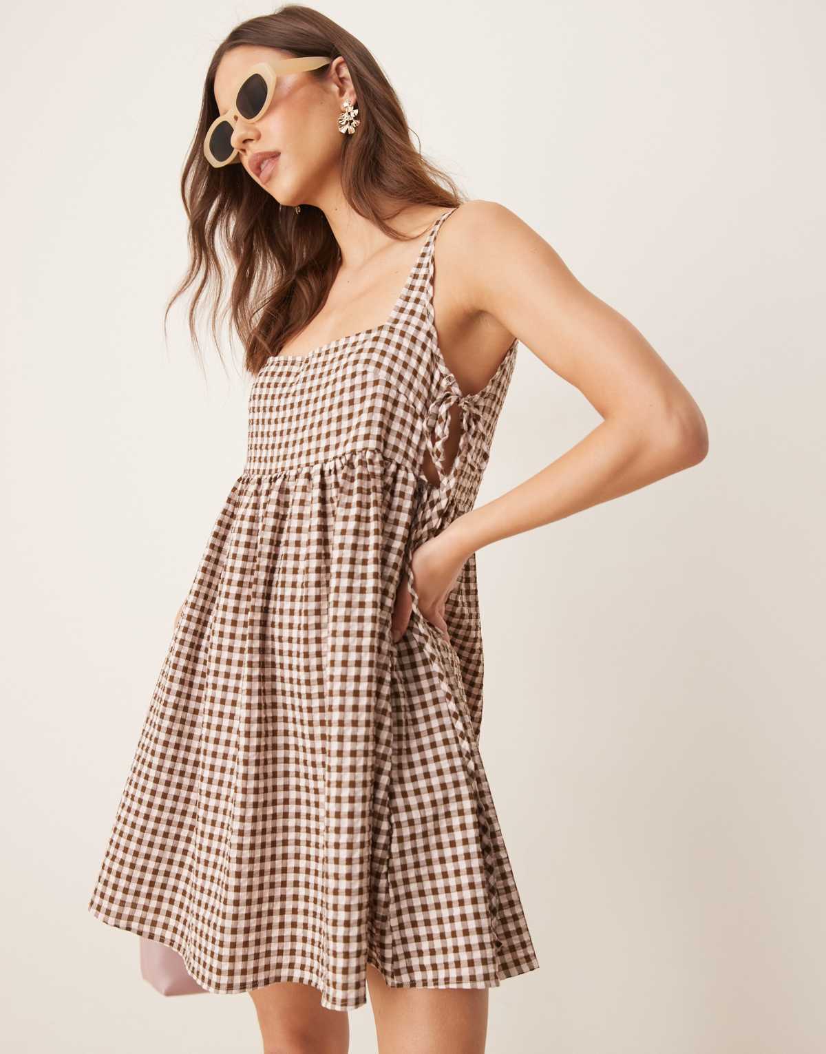 ASOS DESIGN tie side baby doll mini dress in brown gingham