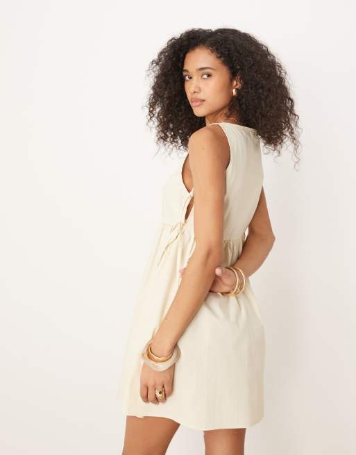ASOS DESIGN tie side baby doll mini dress in buttermilk
