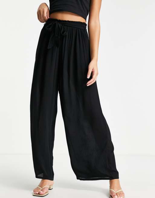 ASOS DESIGN Petite drawstring palazzo beach pants in black