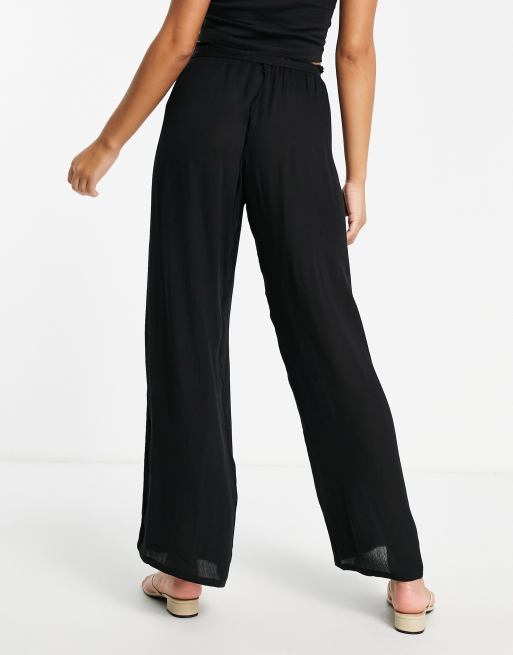 ASOS DESIGN tie waist palazzo beach pants in black