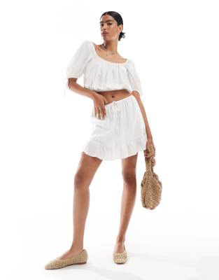 Asos Design Tie Waist Ruffle Hem Mini Skirt In Ivory-white