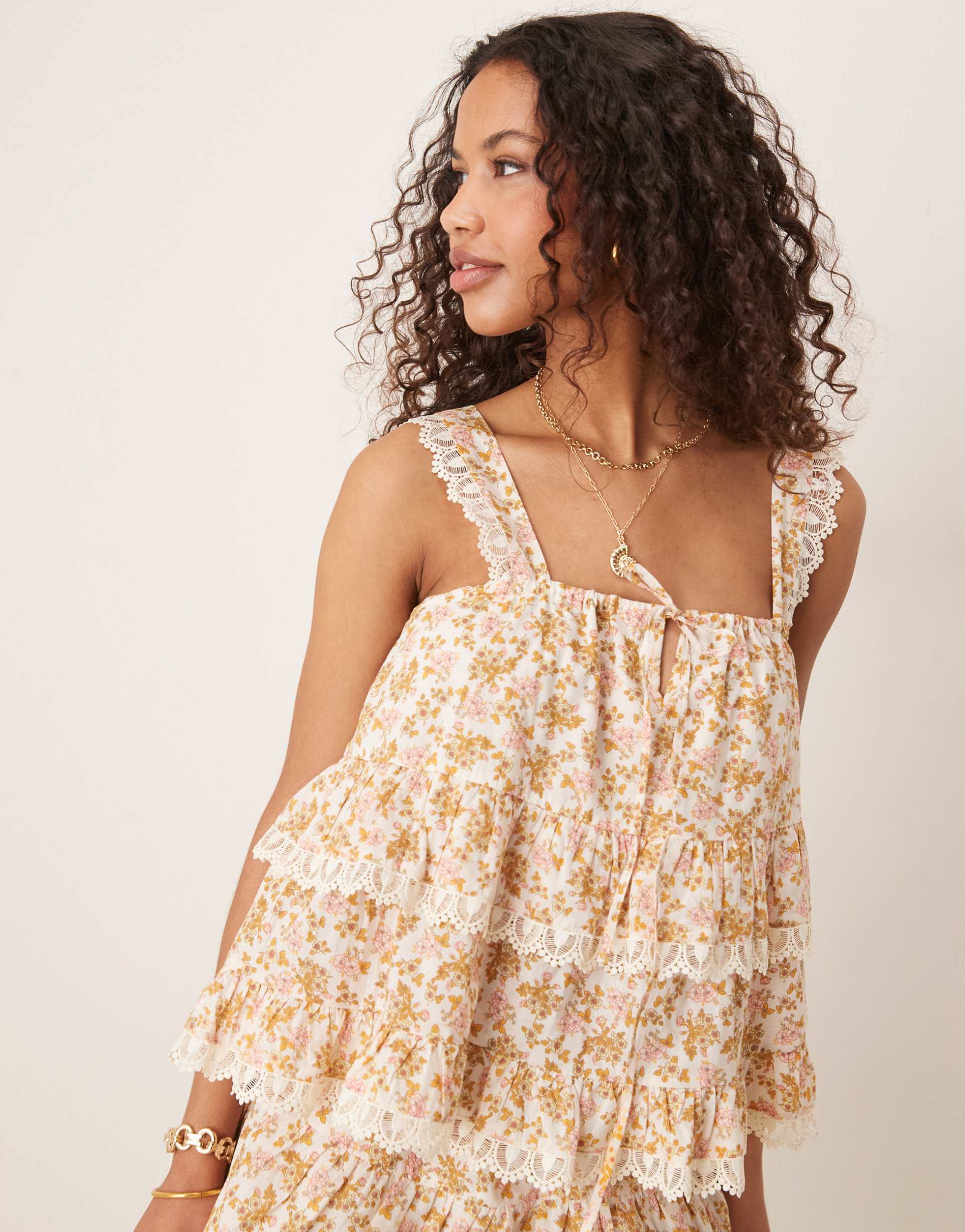 asos design tiered cami top with lace trim in floral print