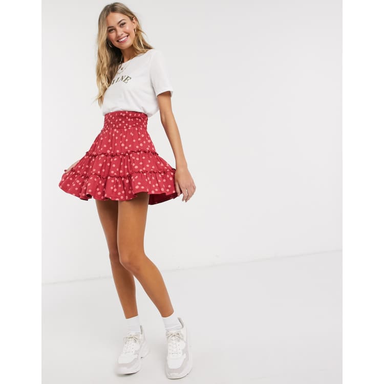 ASOS DESIGN tiered mini skirt in pink polka dot