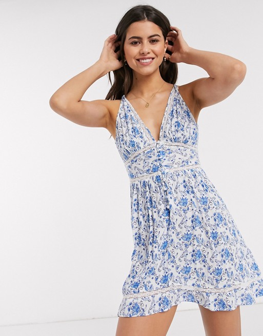 ASOS DESIGN tiered mini sundress with lace inserts in paisley print