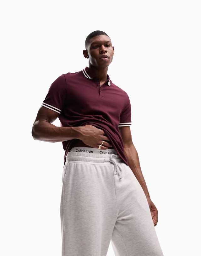 ASOS DESIGN tipped pique polo shirt in burgundy