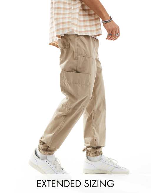 ASOS DESIGN - Toelopende cargo-joggingbroek met elastische taille in bruin 