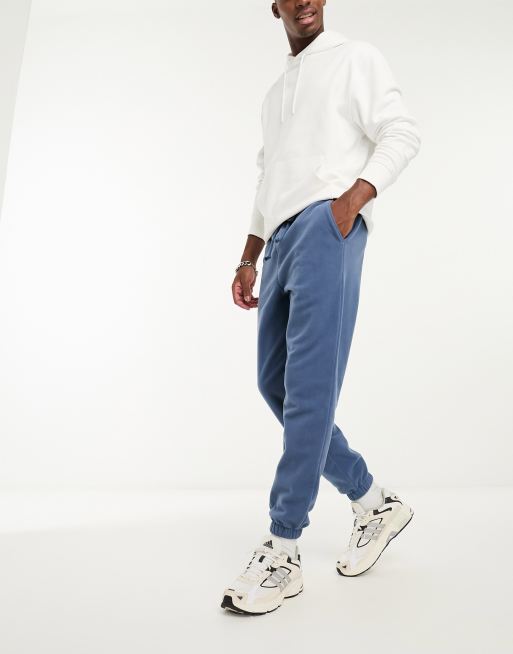 ASOS DESIGN - Toelopende fleece joggingbroek in marineblauw, 3 van 4