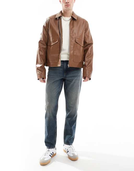 ASOS DESIGN - Toelopende jeans met mid-wash in blauw met tint 