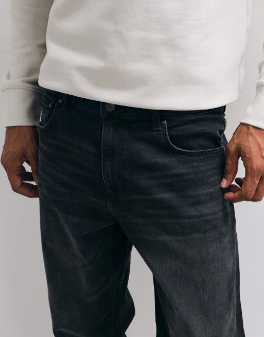 ASOS DESIGN - Toelopende jeans met stretch in verwassen zwart, 4 van 5
