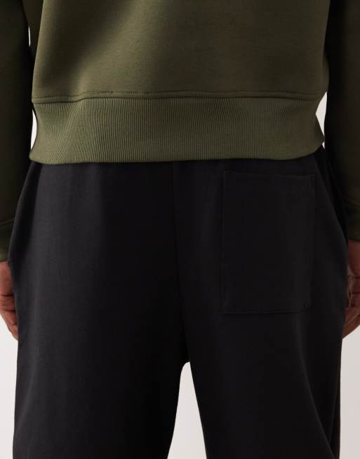 ASOS DESIGN - Toelopende joggingbroek met plooi in zwart, 4 van 5