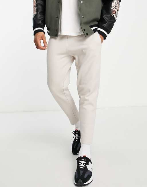 ASOS DESIGN - Toelopende joggingbroek van nette twill met platgestikte plooitjes 