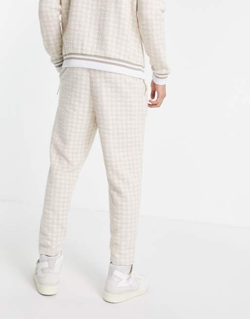ASOS DESIGN - Toelopende nette joggingbroek van geruite stof met structuur, vaste zoom en plooitjes, 2 van 4