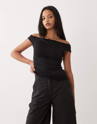 Top à manches asymétriques avec détails en dentelle - Noir L