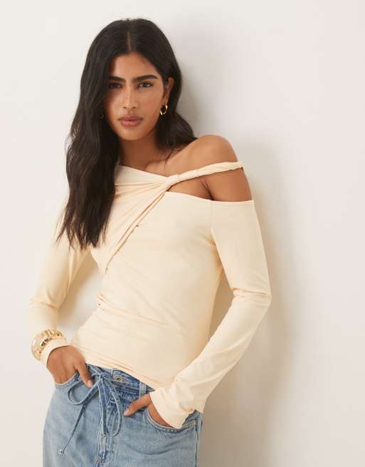ASOS DESIGN - Top a maniche lunghe con cut-out attorcigliato color latticello