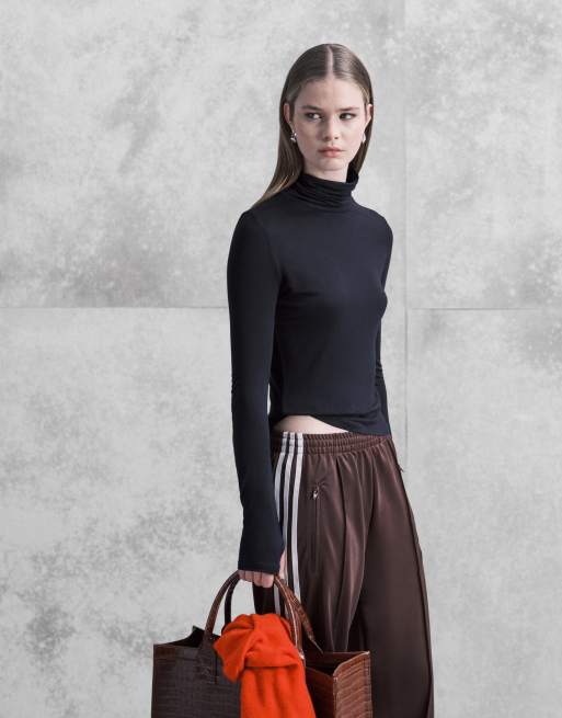 ASOS DESIGN - Top a maniche lunghe nero semitrasparente con scollo a imbuto