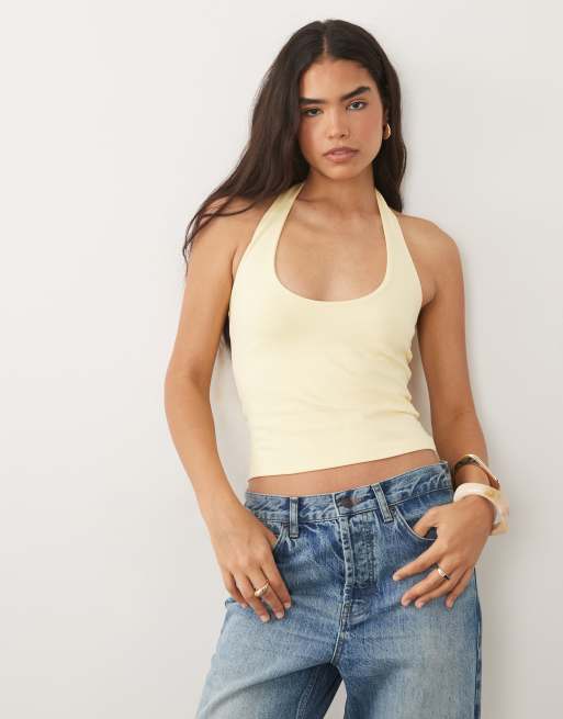 ASOS DESIGN - Top amarillo pastel con diseño minimalista y cuello halter de tejido doble