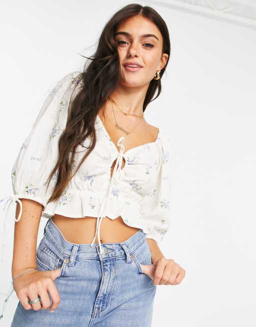 ASOS DESIGN - Top con vita arricciata e allacciato sul davanti a fiori