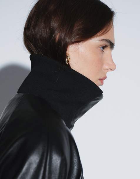 ASOS DESIGN Top entallado deportivo de piel sintética con cuello alzado y cuello acanalado en negro - view 1