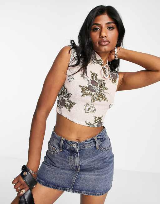 ASOS DESIGN - Top in rete aderente con cut-out e stampa stile tatuaggio