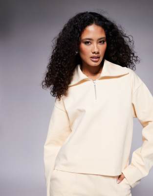 ASOS DESIGN - Top in tessuto interlock color latticello con zip corta in coordinato