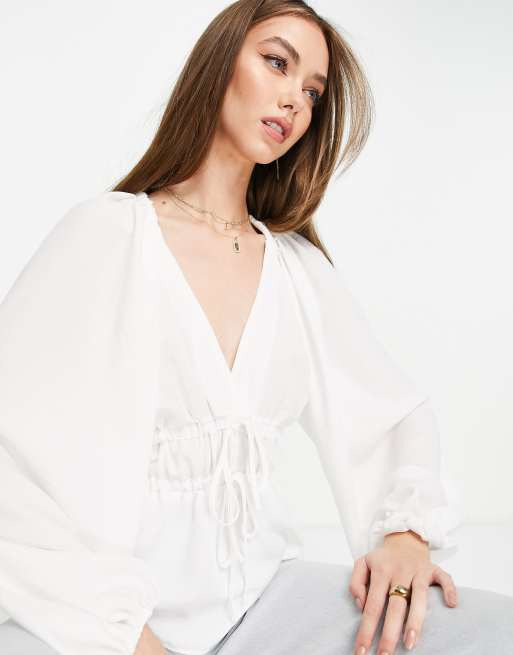 ASOS DESIGN - Top manches longues à col V avec manches kimono et liens noués sur le devant - Ivoire 