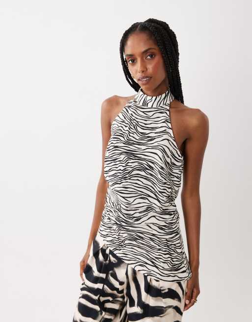 ASOS DESIGN - Top taglio lungo allacciato al collo asimmetrico con stampa in coordinato