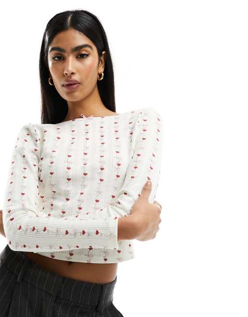 ASOS DESIGN - Top traforato con scollo sul retro color avorio polvere con stampa