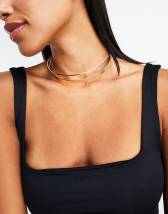 ASOS DESIGN body harness with black draped crystal design in gold