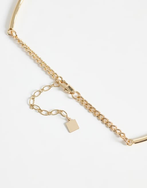 ASOS DESIGN torque-chokerhalsband med svart hängsmycke i guldfärg, 3 av 4