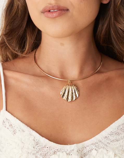 ASOS DESIGN – Torque – Guldfärgat choker-halsband med stor snäcka - view 1
