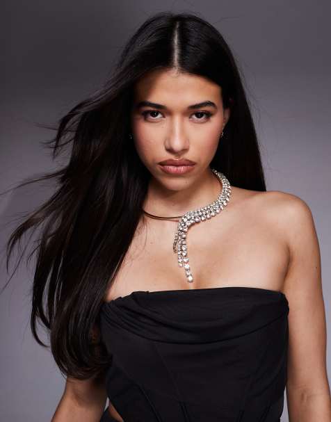 ASOS DESIGN torque necklace with sparkly diamante waterfall detail in gold tone - view 1