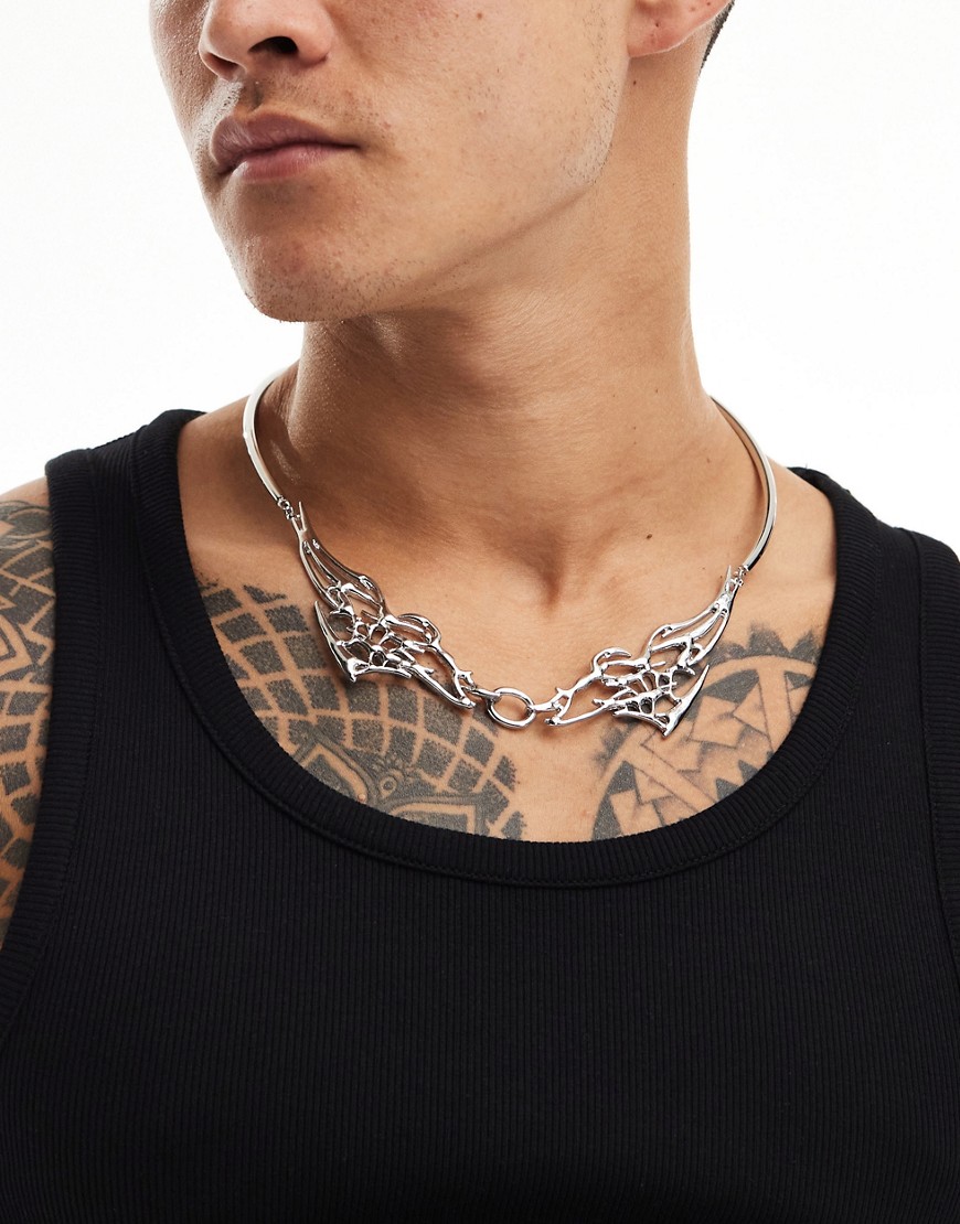 ASOS DESIGN torque necklace with tattoo design in silver tone