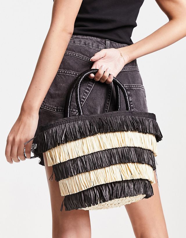 ASOS DESIGN tote bag in straw with black and natural fringe