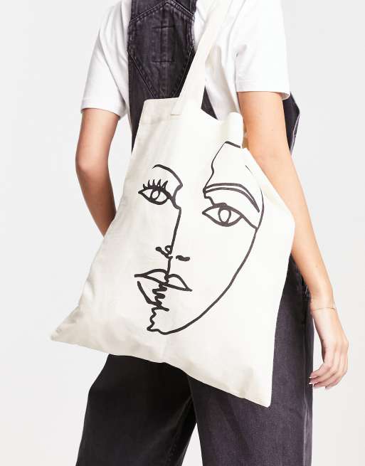 ASOS DESIGN - Tote-taske i bomuld med abstrakt ansigtsprint midt på
