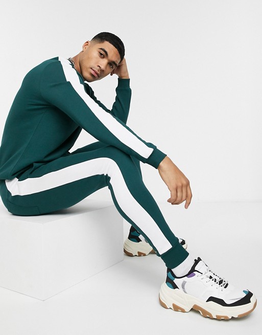 ASOS DESIGN tracksuit crew/ skinny jogger with side stripe in deep green