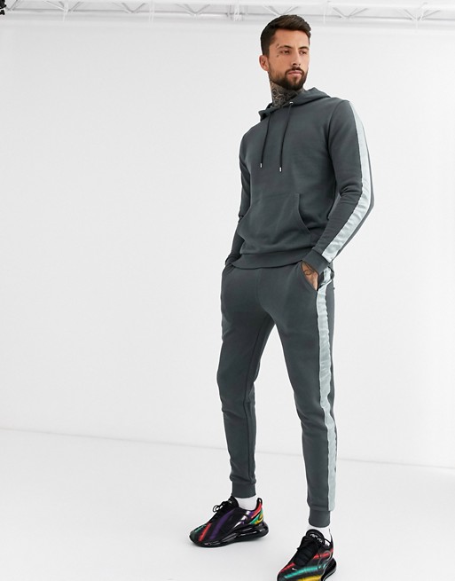 ASOS DESIGN tracksuit hoodie/skinny joggers with satin side stripe in washed black