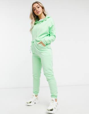 green hoodie and sweatpants