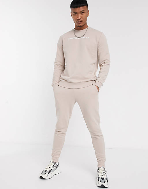 ASOS DESIGN tracksuit in beige with triangle logo | ASOS
