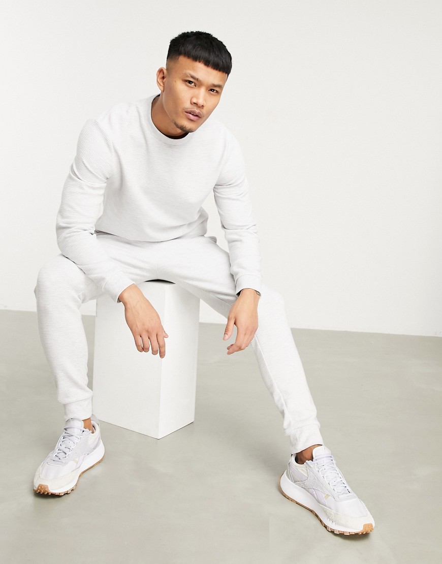 ASOS DESIGN tracksuit in skinny fit in ribbed white heather