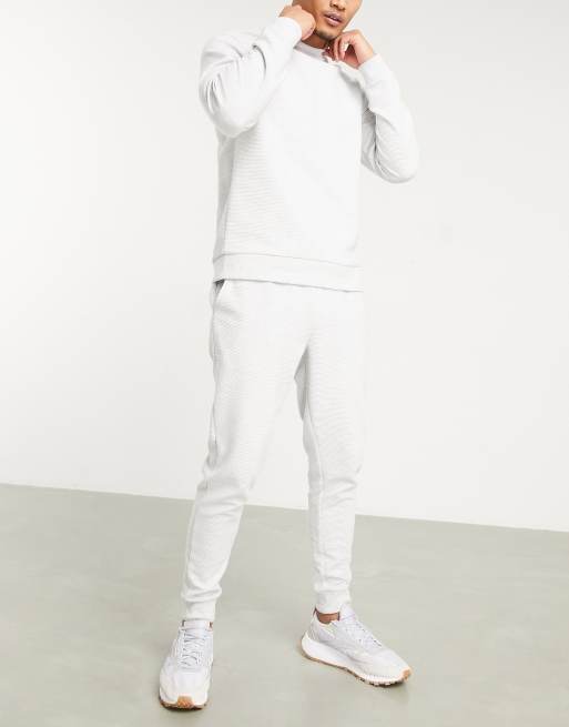 ASOS DESIGN tracksuit in skinny fit in ribbed white heather ASOS