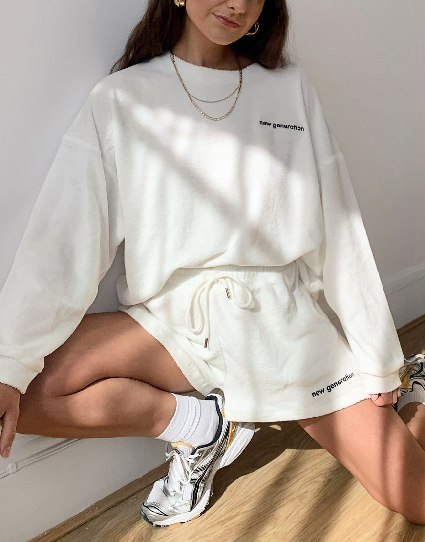 ASOS DESIGN tracksuit in terry oversized sweatshirt and short with embroidered logo in cream-White