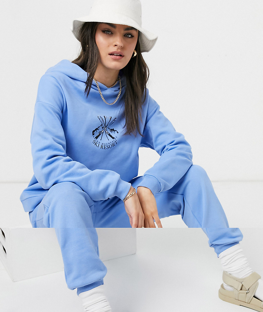 ASOS DESIGN tracksuit oversized hoodie / oversized sweatpants with ski motif in blue-Neutral
