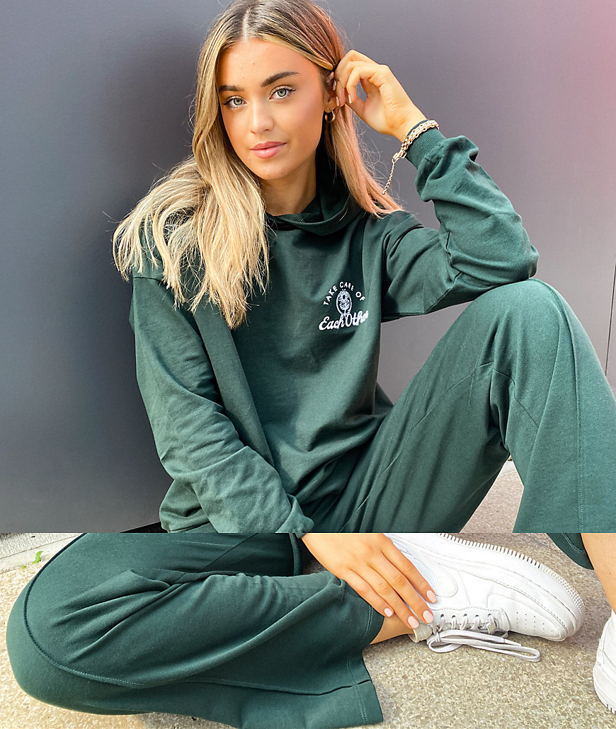ASOS DESIGN tracksuit oversized hoodie / straight leg jogger with take care embroidery in dark green