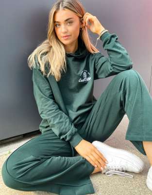 green hoodie and sweatpants