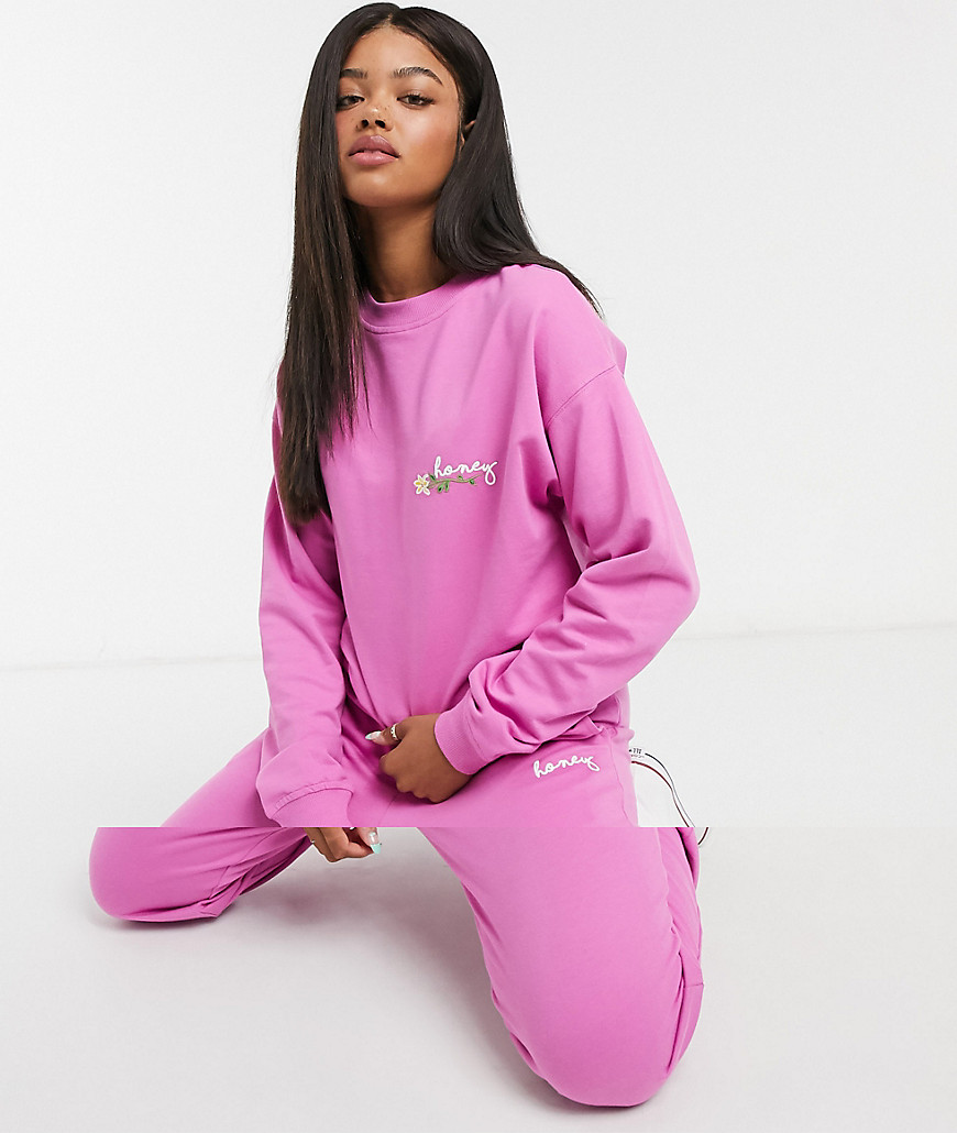ASOS DESIGN tracksuit oversized sweatshirt with embroidered slogan / oversized sweatpants in pink