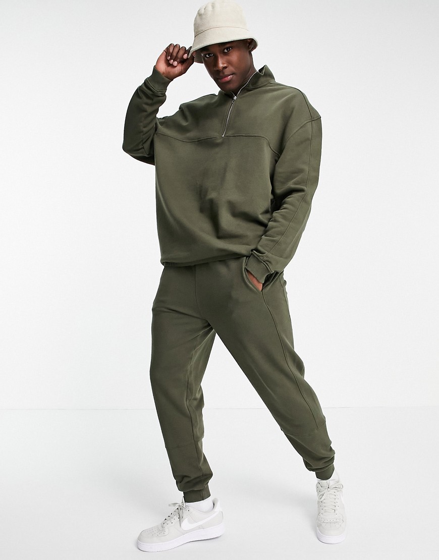 ASOS DESIGN tracksuit with half zip sweatshirt and skinny sweatpants-Green