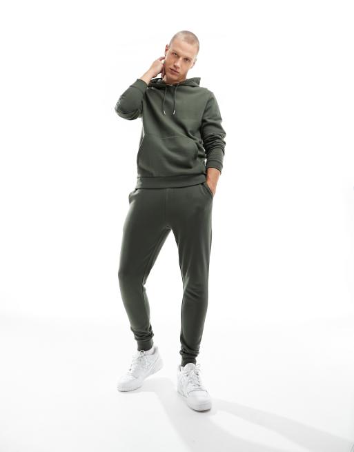 ASOS DESIGN tracksuit with hoodie and skinny joggers in charcoal