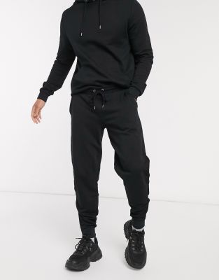 ASOS DESIGN tracksuit with hoodie & joggers with silver zip in black | ASOS